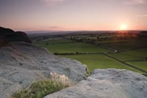 Formation Prints: View over surrounding farmland from Almscliff Crag rock formation at sunset