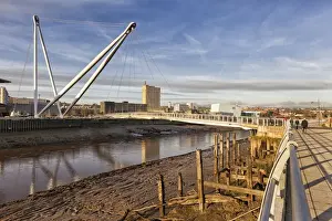 Landmarks Prints: View of tidal river and footbridge