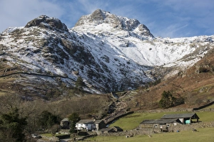 Moorland Prints: View across valley with farm buildings towards snow covered fell