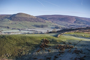View of valley with frost at dawn, Hodder Valley, Hall Hill, Forest of Bowland, Lancashire, England, May
