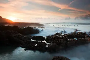 Remains Prints: View of Victorian pier remains exposed during low tide at sunset