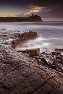 View of wave-cut platform and rocky shore at sunset, The Flats, Kimmeridge Bay, Isle of Purbeck, Dorset, England