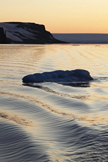 View of waves and ice floe at sunset, Arctic Sea, Spitsbergen, Svalbard, august