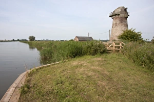 View of windpump and pumphouse at edge of waterway, Clippesby Mill, Ashby with Oby, River Bure, The Broads N. P