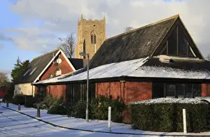 Centres Prints: Village daycare centre, primary school and church tower in snow