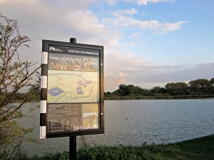 Reservoirs Prints: Visitor Information sign at edge of reservoir