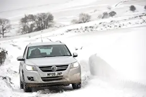 Cars Prints: Volkswagen Tiguan 4x4 travelling along rural road after snowstorm, Cumbria, England, March
