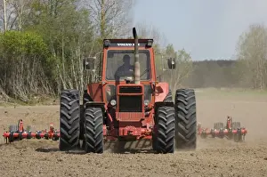 Cultivating Prints: Volvo tractor pulling harrows, cultivating arable field, Sweden