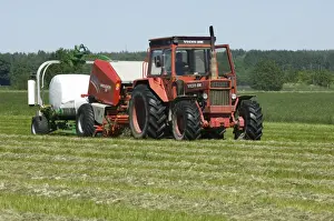 Wrapped Prints: Volvo tractor pulling round baler and mechanical bale-wrapper