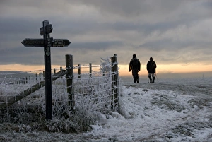 Footpath Prints: Walkers on frost and snow covered footpath