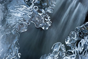Ices Prints: Water flowing under ice in mountain stream, England, december