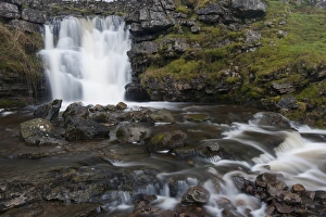 Waterfall on limestone outcrop, Ravenstonedale, Cumbria, England, December