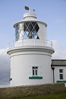 White painted lighthouse on coast, Anvil Point Lighthouse, Durlston, Isle of Purbeck, Dorset, England, january