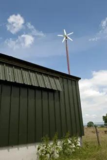 Hens Prints: Wind turbine, powering free-range hen unit building, Cumbria, England, june