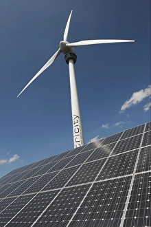 Renewable Prints: Wind turbine and solar panels at ecotech centre, Swaffham, Norfolk, England, august