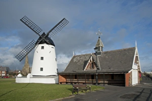 Life Boat Prints: Windmill and old lifeboat house in seaside resort town