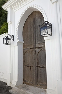Door Prints: Wooden door and lanterns in street of coastal city, Tangier, Morocco, april