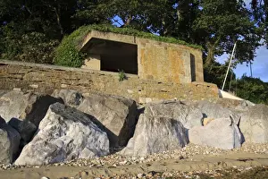 Defence Prints: World War Two gun emplacement and riprap boulders at edge of beach