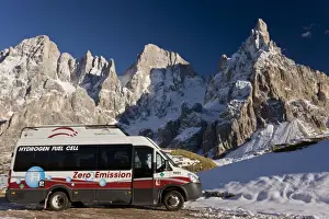 Environmental Prints: Zero emission hydrogen fuel cell vehicle parked below mountain peak