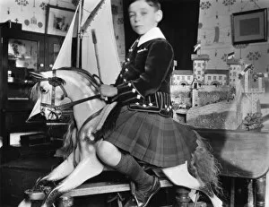 Little boy on rocking horse